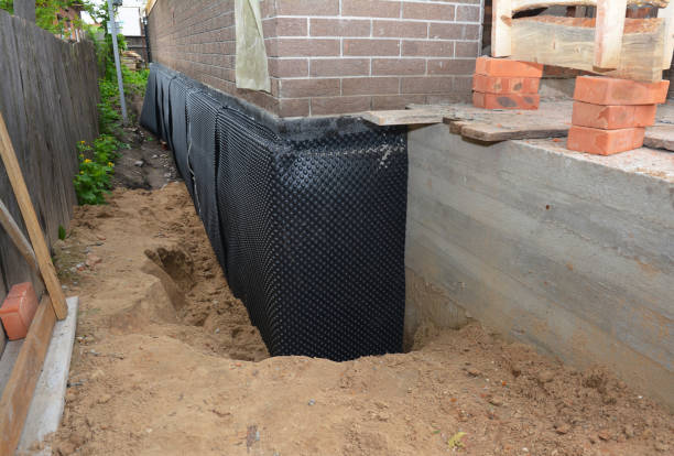 Happy homeowners after waterproofing job in Nekoosa